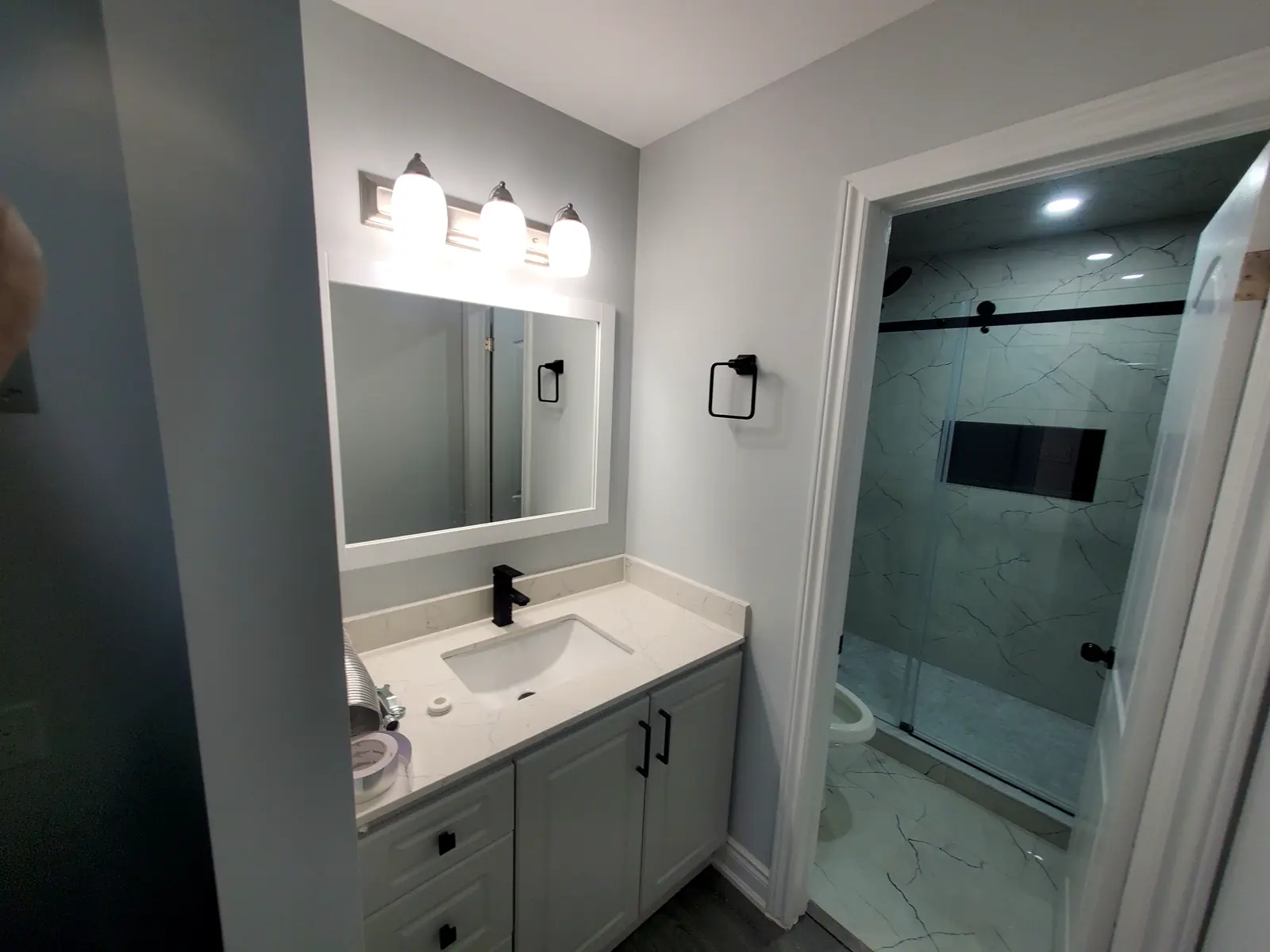 Empire Design & Construction job photo: Bathroom vanity and glass shower