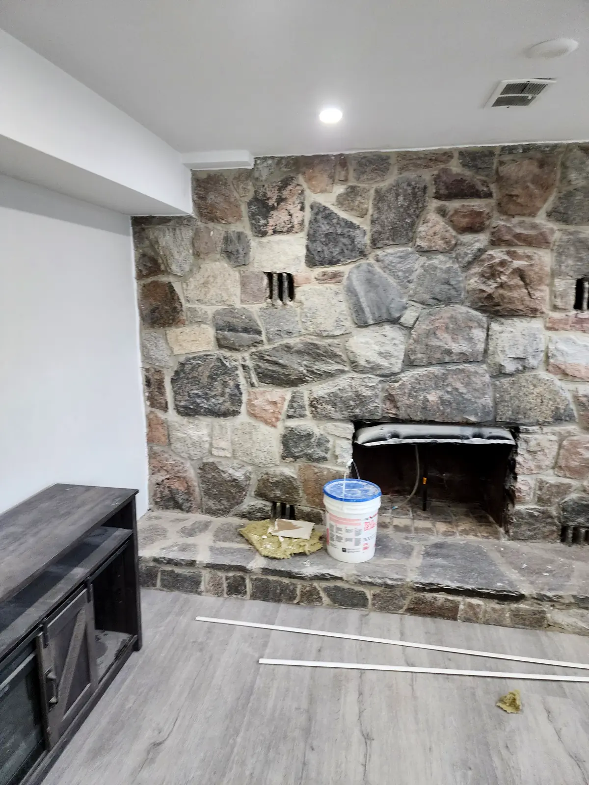 Empire Design & Construction job photo: Stone fireplace wall